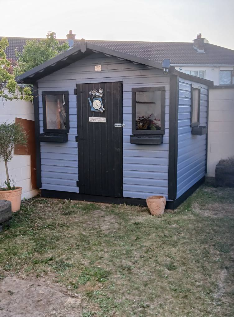 Freshly painted shed after restoration